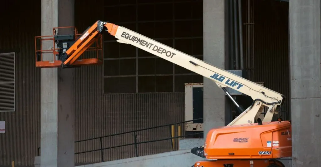 pexels-photo-27330792-27330792 Orange JLG lift positioned at an industrial construction site, ready for use.